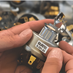 someone holding a switch relay in their hand